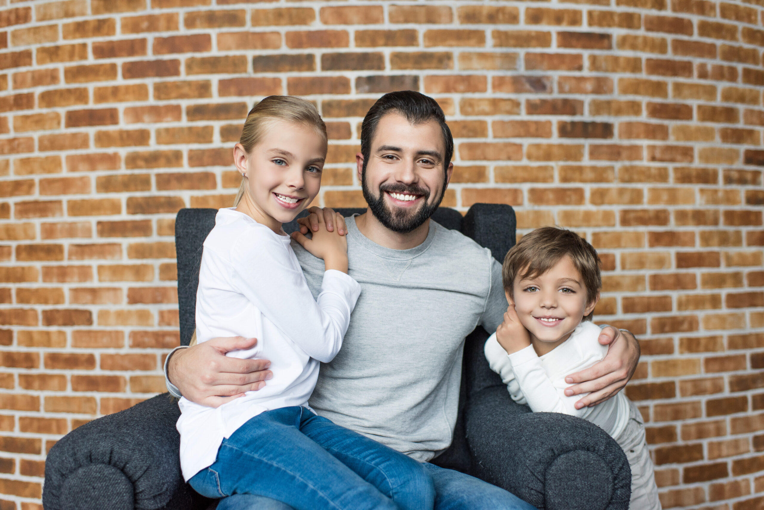 father on chair discussing life insurance